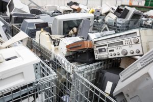 A room full of discarded computers and electronics